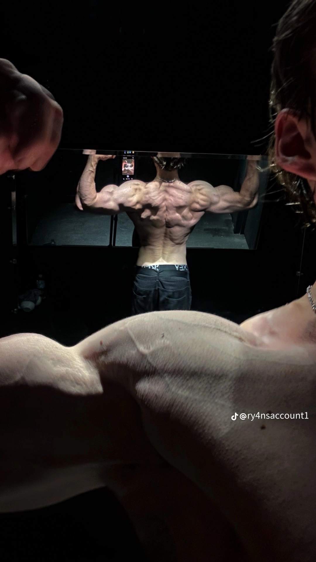 Ryan showing his back development in the gym